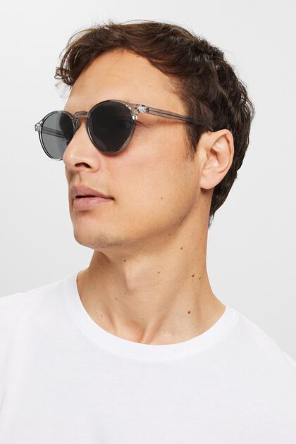 Solglasögon med transparent rund båge